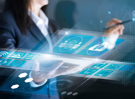 Woman looking at abstract graphic overlay reports