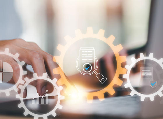 Abstract image with automation and gear icons in the focus and office environment in the background