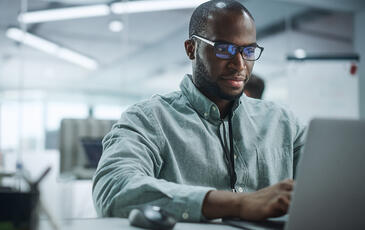 Man working on laptop in the office
