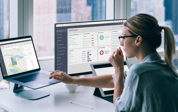 Woman looking at screens with TEMS Cloud software