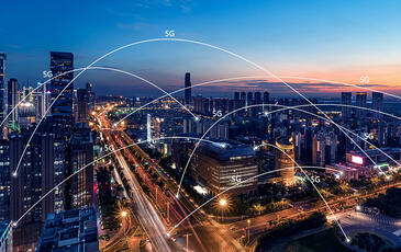 5g network connections over dense city at night