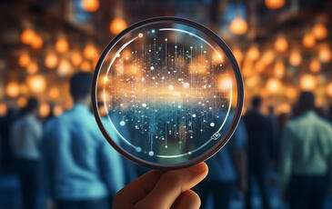 Hand holding magnifying glass, for holistic observability