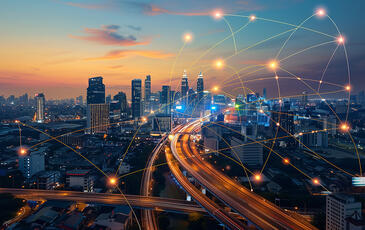 Dark city with connectivity network graphic overlay