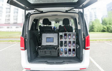 TEMS Paragon benchmarking equipment installed in drive test van.