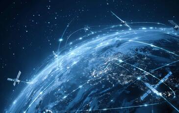 Illustration of Earth with global satellite network and blue futuristic plexus, symbolizing Non-Terrestrial Networks in 5G Advanced connectivity.