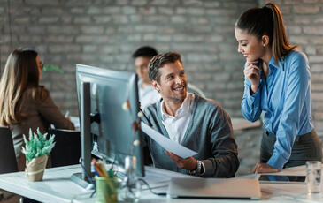 Working contact center team discussing reports