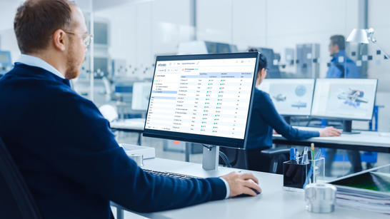 Man looking at Ativa SD-WAN monitoring solution screen