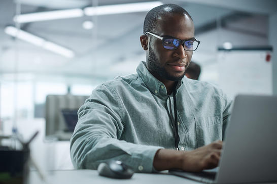 Man working on laptop in the office