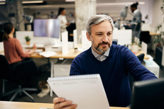 Man working at the office looking at screen