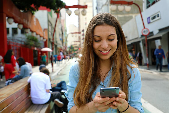 City woman looking at her mobile phone