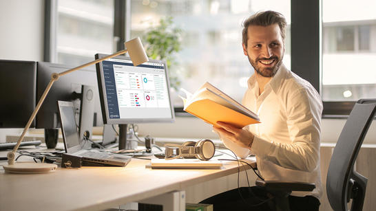 Man in the office working on TEMS Cloud