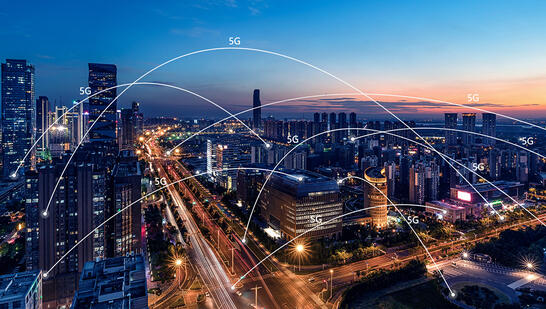 5g network connections over dense city at night
