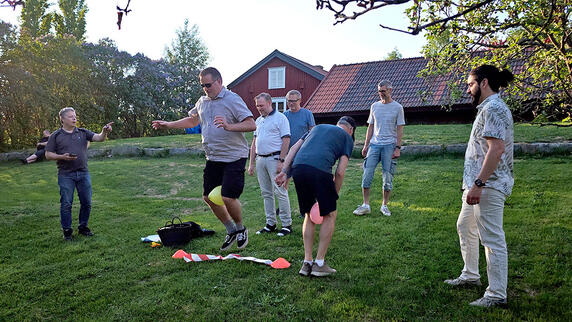 Skelleftea team enjoying outdoor games and laughs at the company summer party, making the most of sunny weather and good vibes.