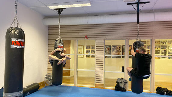 Team members measuring force during a workout session, competing to see who will come out on top!