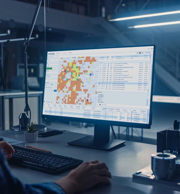 Woman looking at Ativa Optimize application on screen