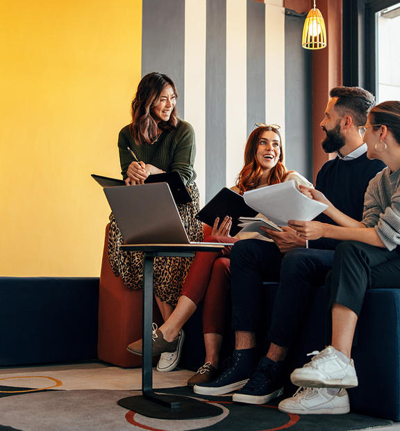 Multicultural businesspeople working in an office lobby