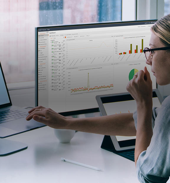 Woman looking at reports from TEMS Cloud, Infovista's real-time control and analytics solution