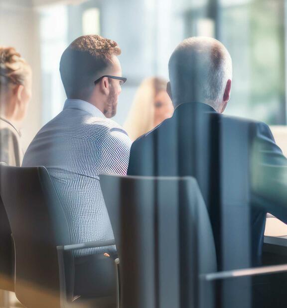 Partners meeting in a conference room