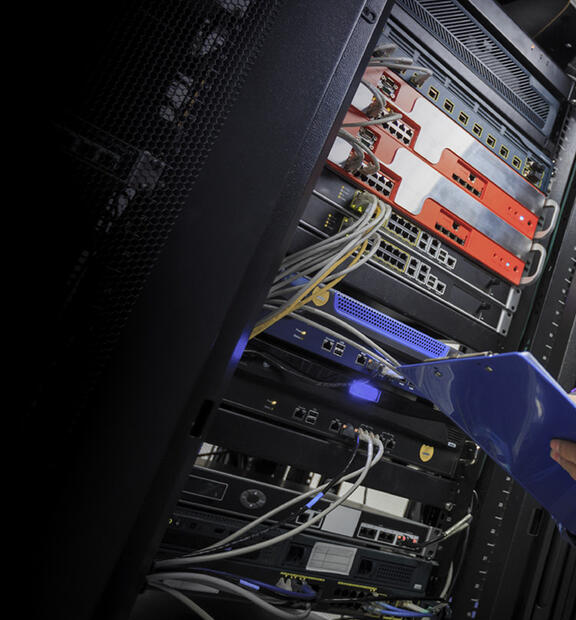 Asian man working in a data center