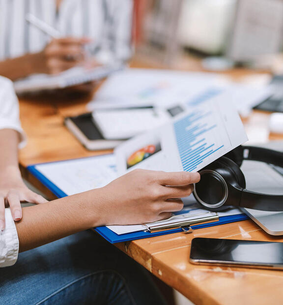 Closeup image of office desk with report