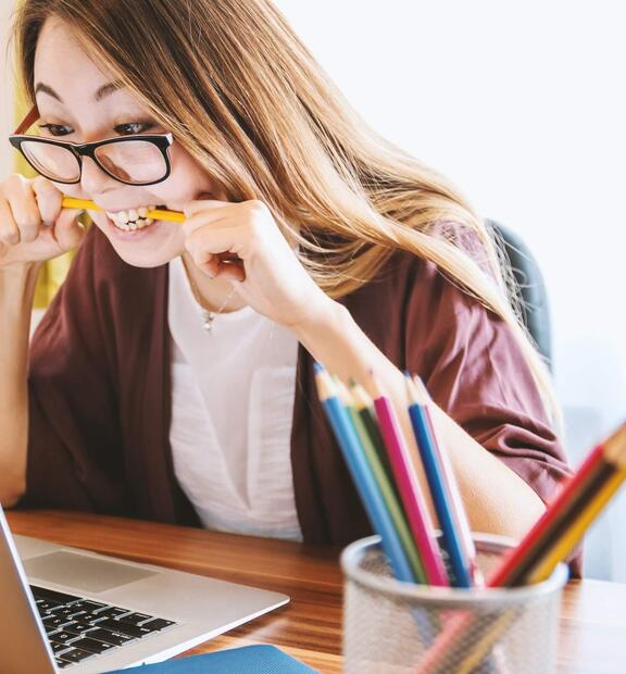 Frustrated woman looking at her laptop