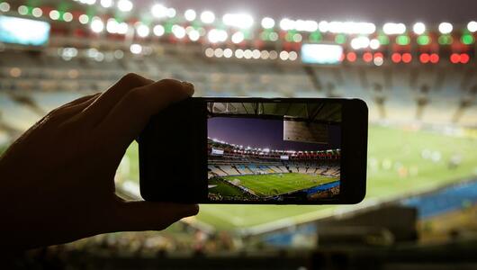 Taking picture of a sports game with mobile phone
