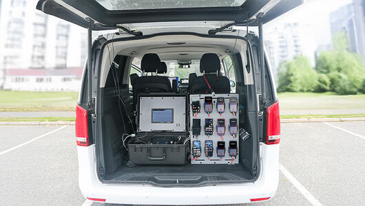 TEMS Paragon multi-device benchmarking solution installed in test van for network performance testing.