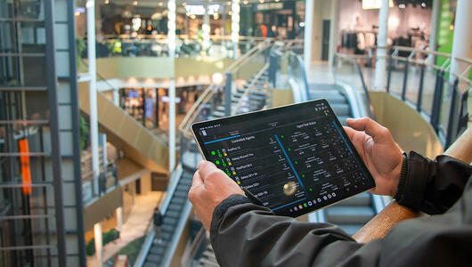 TEMS Pocket controller displaying network performance test status on tablet during mall testing.