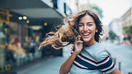 Happy woman talking on a phone