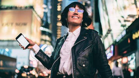 Happy woman holding phone