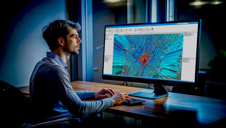 Business man working on 4G and 5G network planning with Planet