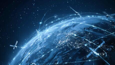 Illustration of Earth with global satellite network and blue futuristic plexus, symbolizing Non-Terrestrial Networks in 5G Advanced connectivity.