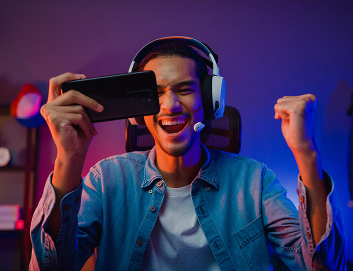 man with headphones and phone
