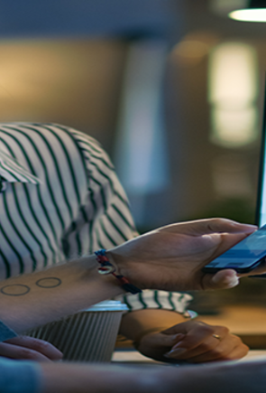 Man and Woman on Phone and Laptop